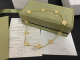 Gold necklace on a green box with Van Cleef & Arpels branding