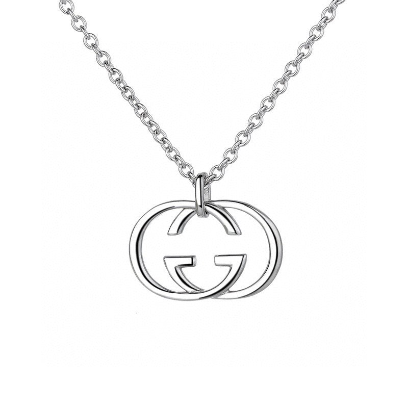 A silver-tone interlocking G logo pendant necklace on a matching chain, shown against a plain white background.