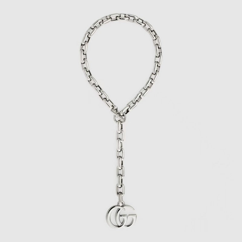 A silver-tone chain necklace featuring a large top loop and a dangling chain with a polished interlocking GG logo pendant, shown on a light gray background.