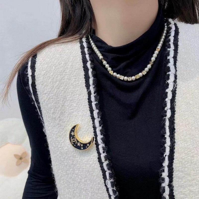 18K CC 25K Black Moon Brooch